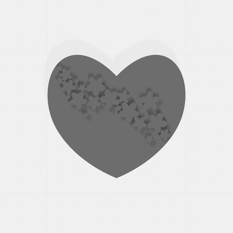 May include: A gray heart shape with a floral design. The heart is a solid gray color, and a cascade of small, white flowers is arranged diagonally across it. The background is a white grid pattern.