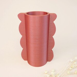 Red scalloped vase 3D print with curved shape and decorative side details