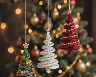 May include: Three hanging crochet Christmas tree ornaments in green, white, and red. The green tree features multicolored beads, the white tree has silver beads, and the red tree has gold beads. Each ornament is topped with a small star.