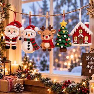 May include: Five crocheted Christmas ornaments hanging from a string: a Santa Claus, a snowman with a red and green scarf, a reindeer with a red scarf, a decorated Christmas tree, and a small red house with white trim and a light inside.