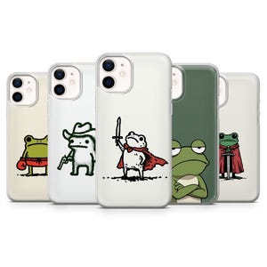 以下が含まれることがあります： 漫画のカエルのイラストが描かれた5つの携帯電話ケース。カエルはボクサー、カウボーイ、騎士、腕を組んだカエルなど、さまざまな衣装で描かれています。ケースは透明または緑色の背景です。