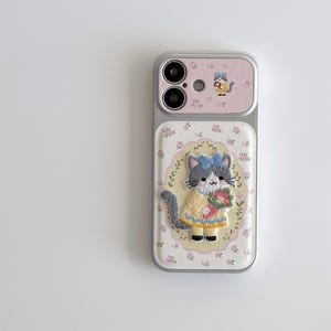 a phone case with a cat design, including a cat wearing a yellow dress and holding a flower.