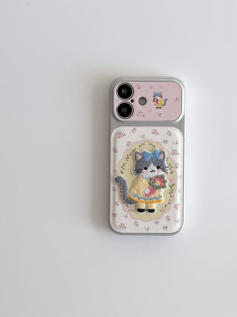 a phone case with a cat design, including a cat wearing a yellow dress and holding a flower.