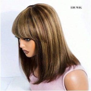 May include: A brown wig with blonde highlights and a blunt bang. The wig has a shoulder-length cut and is styled with straight hair. The text "EBUWIG" is visible in the upper right corner.