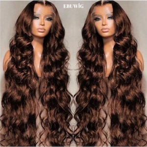 May include: Two identical brown wavy wigs are displayed. The wigs have long, flowing hair with a natural-looking texture. The wigs are styled with a deep part and are designed to look realistic. The text "EBUWIG" is visible at the top.