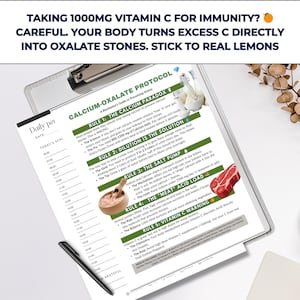 May include: A detailed document with the title "Calcium-Oxalate Protocol" is displayed on a clipboard. The document provides information on preventing kidney stones, with text and illustrations. A black pen rests on the document. The top of the document has the text: "TAKING 1000MG VITAMIN C FOR IMMUNITY? CAREFUL. YOUR BODY TURNS EXCESS C DIRECTLY INTO OXALATE STONES. STICK TO REAL LEMONS."