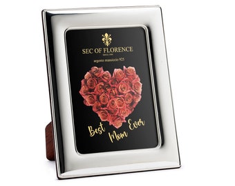 May include: Silver picture frame with a black background and a heart-shaped arrangement of red roses. The text "Best Mom Ever" is written in gold lettering.