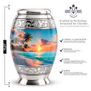 May include: A cylindrical aluminum cremation urn featuring a tropical beach sunset scene with palm trees, ocean waves, and a vibrant orange sky. The urn has a silver metallic lid and base with engraved floral patterns, measuring 10.23 inches in height.