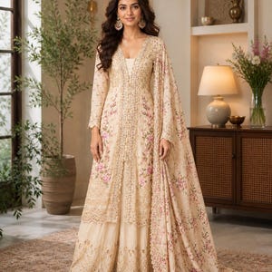 cream color indian dress Panache Bride and Groom- Rekha and Neville chose matching cream outfits to their wedding. The bride is in the Nude Cream Dori Lehenga and the groom is in Nude Cream Open Sherwani