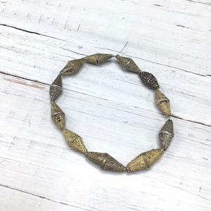 Strands of 11 Gilded / Silver Granulated Bicone Beads from Mauritania, Damaged/Imperfect Condition - Rita Okrent Collection (ANT540c)
