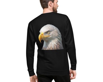 May include: Black sweatshirt featuring a detailed graphic of a bald eagle's head. The eagle has white feathers, a yellow beak, and a focused gaze. The sweatshirt is a solid black color.