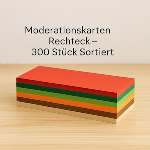 Może przedstawiać: Prostokątny stos kart w różnych kolorach, w tym czerwonym, zielonym, pomarańczowym i brązowym. Karty są starannie ułożone, a górna karta jest w żywym czerwonym kolorze. U góry widnieje napis "Moderationskarten Rechteck - 300 Stück Sortiert."