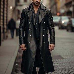 May include: A black leather trench coat with a double-breasted design and silver buttons. The coat has a classic lapel collar and long sleeves. The coat is knee-length and appears to be made of a smooth, shiny material.