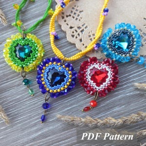May include: Four beaded necklaces with heart-shaped pendants. The pendants feature colourful beadwork in green, blue, and red, with a large central gem. The necklaces have yellow and green beaded chains. The text "PDF Pattern" is visible.
