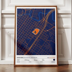 May include: A framed print featuring a map of Houston, Texas, with a focus on the Daikin Park area. The map uses a navy blue background with orange grid lines and highlights the stadium in orange. The print includes text with the stadium's name, coordinates, and other details.