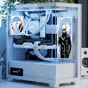 May include: A white computer case with internal components illuminated by blue lights. Two fans feature anime character illustrations. The case sits on a desk with a small speaker and a plant in the background.