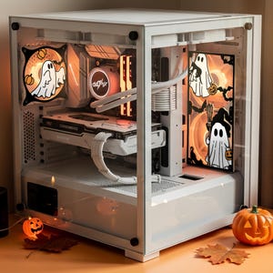 May include: A white computer case with a clear side panel, showcasing internal components. The case is decorated with Halloween-themed graphics, including ghost and pumpkin designs. An orange pumpkin and a jack-o'-lantern are placed near the case.
