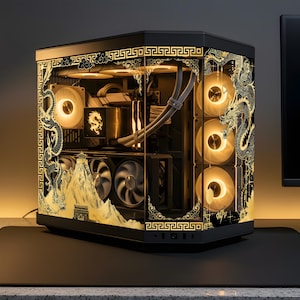 May include: Black computer case with gold dragon and mountain graphics. The case has multiple fans with a warm glow. The design includes a decorative border and a dragon on the side. The case sits on a black surface.