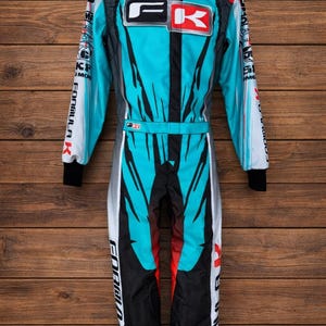 May include: A set of three ceramic mugs with a speckled, matte finish. The mugs are in shades of cream, light gray, and dark gray. Each mug has a simple, minimalist design, perfect for coffee or tea.