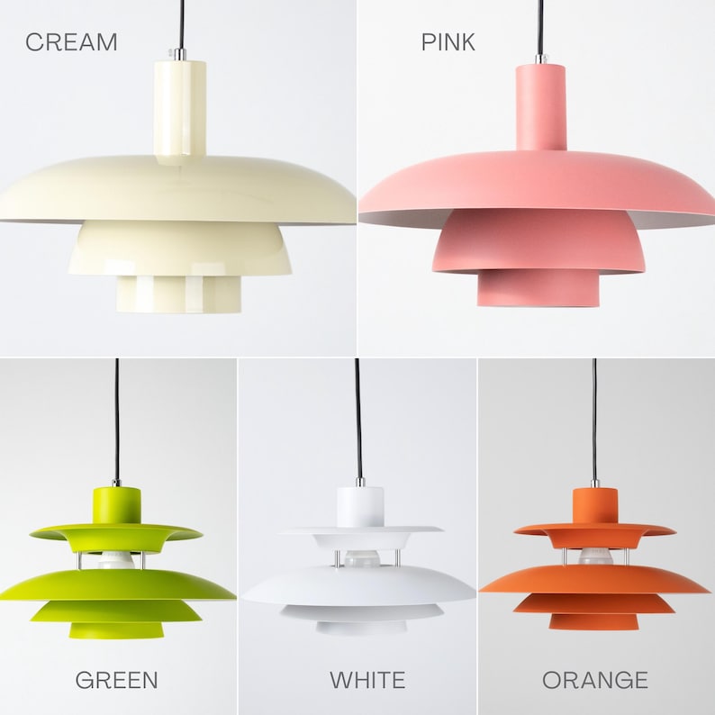 May include: A collection of pendant lights in various colors: cream, pink, green, white, and orange. Each light has a tiered, saucer-like shade design and a black cord. The colors are labeled in the image.