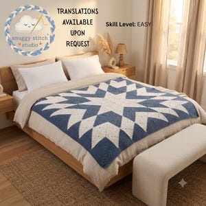 May include: A blue and white crocheted blanket featuring a large central star pattern, displayed on a bed. The image includes the text "snuggy stitch studio", "TRANSLATIONS AVAILABLE UPON REQUEST", and "Skill Level: EASY" in the upper left area.