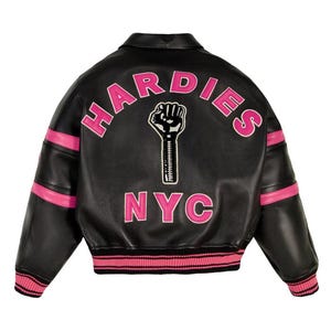 May include: Black leather jacket with pink accents and the text "HARDIES NYC" in pink. The jacket features a graphic of a raised fist. The sleeves have pink stripes, and the collar and cuffs are ribbed with pink and black stripes.
