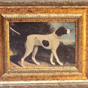 May include: A framed painting of a black and white dog in a field. The dog is standing and looking to the right. The painting is in a gold frame.