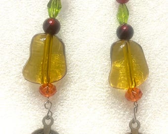 Dangle earrings in Amber, Orange, Dark Red and green crystals with coin dangler.  3” long