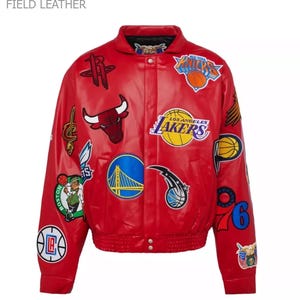 May include: A red leather jacket with multiple team patches, including the Lakers, Knicks, and Bulls. The jacket has a ribbed hem and cuffs, and the text "FIELD LEATHER" is visible at the top.