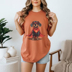 Detailed artwork of a dachshund in a red hero outfit with a flying cape