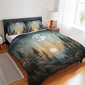 May include: Bedding set with a forest and moon design. The duvet cover and two pillowcases show a landscape with tall pine trees, clouds, and a celestial design in shades of blue, grey, and orange. The design includes a full moon and a setting sun.