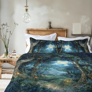 May include: A bedding set featuring a dark blue and green forest scene with large trees, a winding path, and a glowing full moon. The design includes small yellow lights scattered throughout the foliage, creating a nocturnal woodland atmosphere.