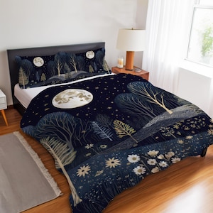 May include: Bedding set with a dark blue night scene design, featuring a large moon, trees, and stars. The set includes a duvet cover and two pillowcases. The design has a whimsical, illustrated style with gold and white accents.