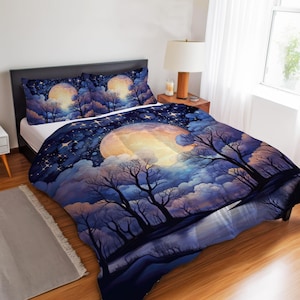 May include: Bedding set with a nighttime scene of a large moon, trees, and stars. The duvet cover and pillowcases have a watercolour design in blue, purple, and yellow. The set creates a tranquil, dreamlike atmosphere.