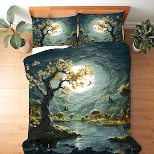 May include: A bedding set featuring a duvet cover and two pillowcases with a printed landscape scene. The design depicts a large tree with yellow leaves beside a lake under a bright full moon, surrounded by dark blue hills and small houses.