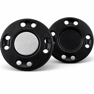 May include: Two black, circular magnetic clasps. Each clasp has a series of small holes around the perimeter and a silver mesh circle in the center. The clasps are designed to connect and secure items.