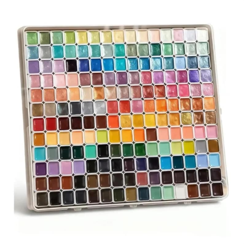 May include: A square palette containing a large collection of small, individual watercolor paint pans arranged in a grid. The set features a wide spectrum of colors, including metallic, pastel, and vibrant shades, all housed in a white plastic tray.