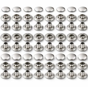 May include: A collection of silver-colored snap fasteners, arranged in rows. Each fastener consists of a cap and a base, with decorative detailing on the base. The fasteners are designed for use in various sewing and crafting projects.