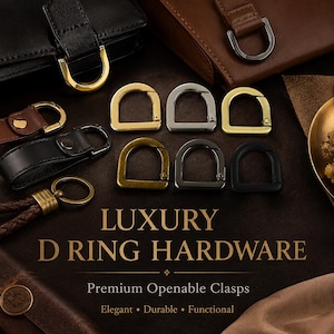 Könnte beinhalten: Eine Auswahl an D-Ring-Hardware in Gold-, Silber- und Schwarz-Ausführungen. Das Bild zeigt zu öffnende Verschlüsse, Lederaccessoires und den Text "LUXURY D RING HARDWARE". Die Verschlüsse werden als elegant, langlebig und funktional beschrieben.