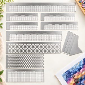 May include: A collection of silver-coloured metal diamond painting rulers and straighteners. The set includes several rectangular templates with various grid patterns, including small dots, crosses, and plus signs, alongside four triangular tools.