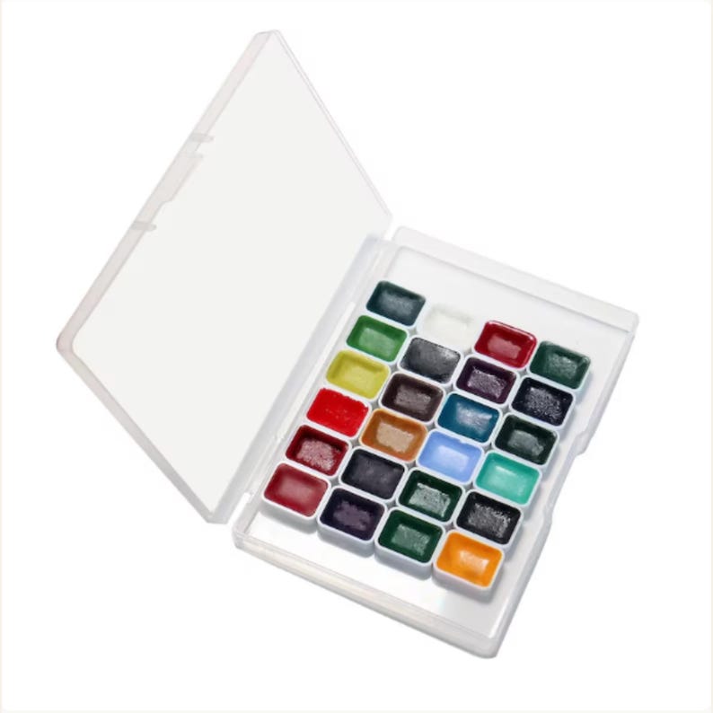 24-color professional watercolor paint set inside portable white travel case.