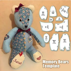 May include: A stuffed bear made from blue and white striped, floral, and polka-dot fabric, featuring a dark red bow, wooden buttons, and the name Sarah embroidered on one foot. Beside it are white paper sewing patterns labeled Memory Bears Template.