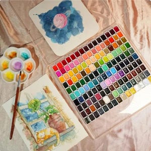 150-color premium watercolor paint palette displaying complete artist color collection.
