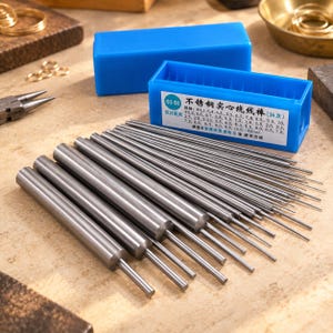 May include: A set of 36 stainless steel wire wrapping mandrels in a blue plastic storage case. The mandrels feature varying diameters ranging from 0.5 mm to 10.0 mm, as indicated by the text on the case label. The tools are arranged in a row.