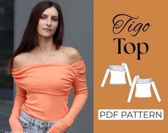 Könnte beinhalten: Ein pfirsichfarbenes Oberteil mit langen Ärmeln und freier Schulter. Das Bild enthält den Text "Tigo Top" und "PDF PATTERN". Das Oberteil wird mit einer blauen Jeans kombiniert. Das Logo The Seam Studio ist unten links sichtbar.