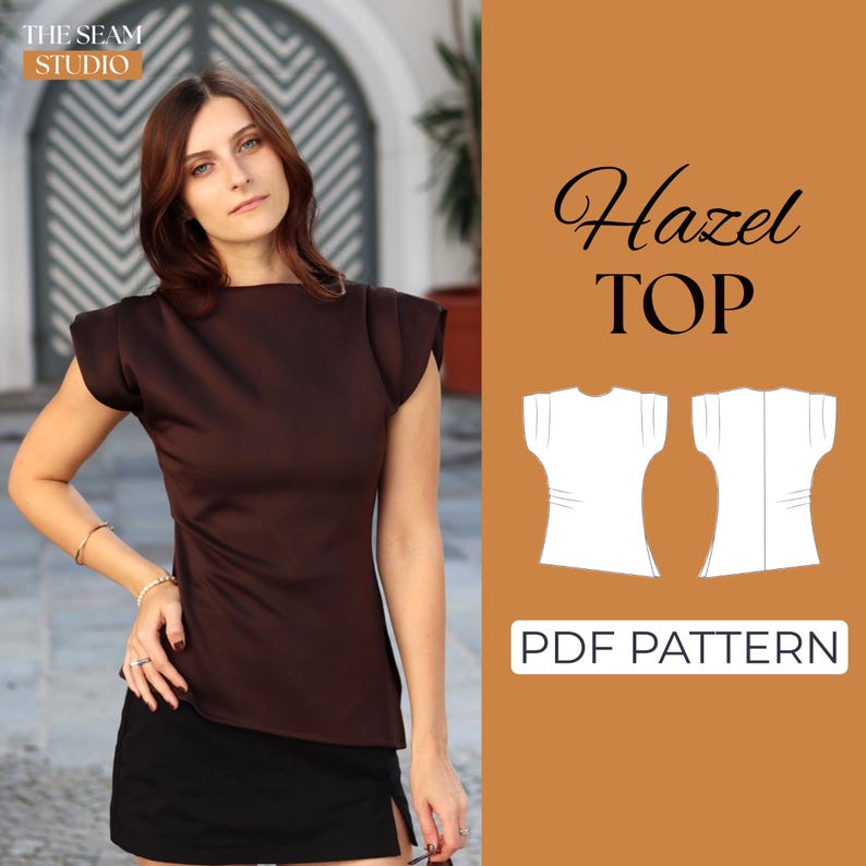 May include: A woman wearing a brown top and black skirt. The top has short sleeves and a round neckline. The image also includes a graphic of a white top and the text "Hazel TOP" and "PDF PATTERN".