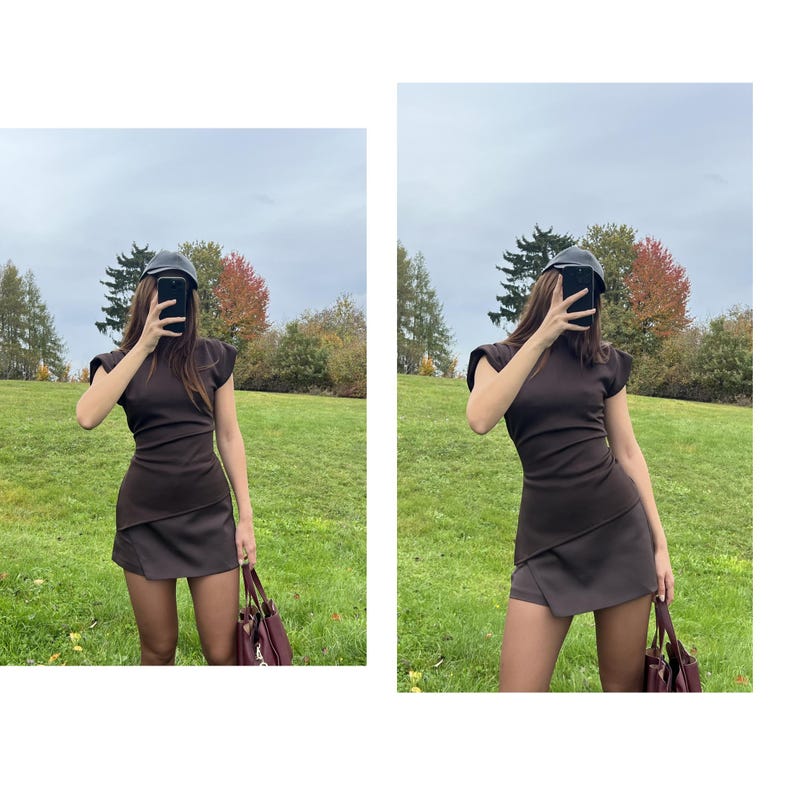 May include: A brown dress with a mock neck and cap sleeves. The dress has a wrap-style skirt and is paired with a dark hat and a burgundy handbag. The background features a green field and trees.