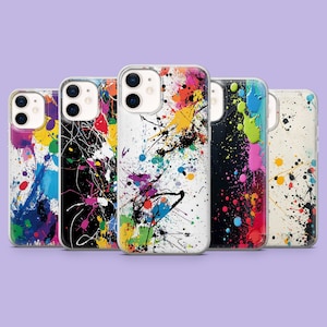 Puede incluir: Una colección de cinco fundas para teléfono con diseños abstractos de salpicaduras de pintura coloridas. Las fundas presentan una variedad de colores, incluyendo azul, amarillo, rosa y negro, creando un aspecto vibrante y artístico. Las fundas están diseñadas para un smartphone.