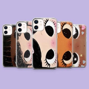 May include: Five phone cases with distinct illustrations. Each case showcases a different design, including a face with large eyes, a starry night, and celestial elements. The cases are in shades of brown, pink, and black.