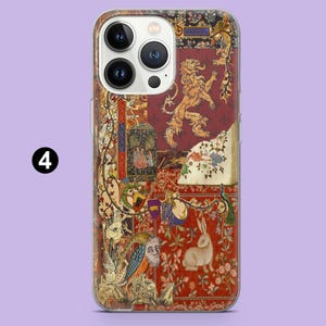 May include: A phone case featuring a detailed tapestry design with a lion, rabbit, and floral elements in red, gold, and cream colors. The case has a clear border and the number "4" in a black circle.